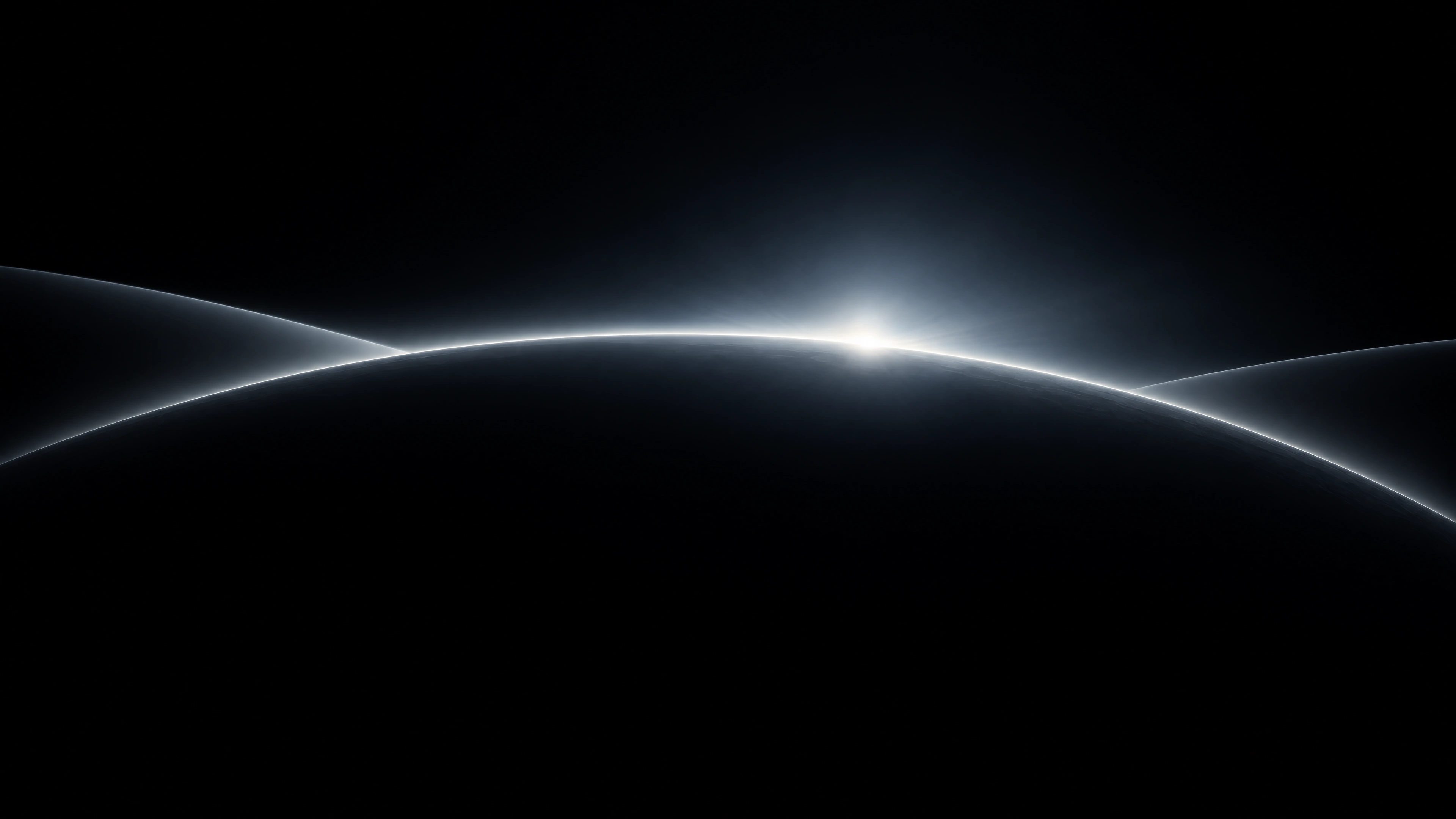 A silver orbital horizon emerging from the dark